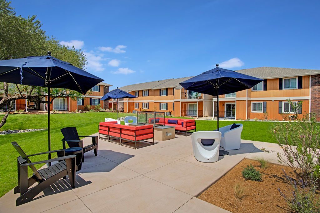 A sunny day at the outdoor seating area of a residential building.